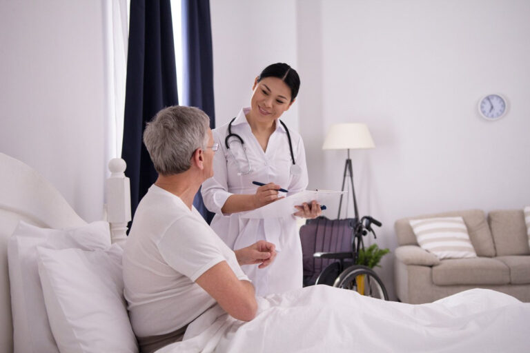 beautiful-nurse-doing-quick-check-up-patient-cheerful-friendly-asian-doctor-holding-clipboard-check-how-her-aged-patient-is-doing